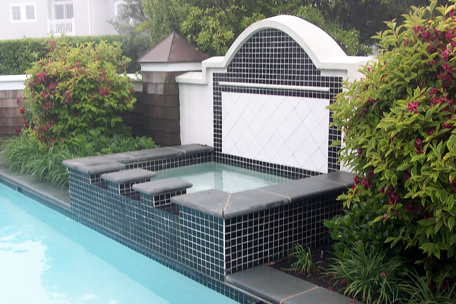 Outdoor Pool and Spa with Water Feature and Pool CoverResidential Pool Design by Omega Pool Structures, Inc
