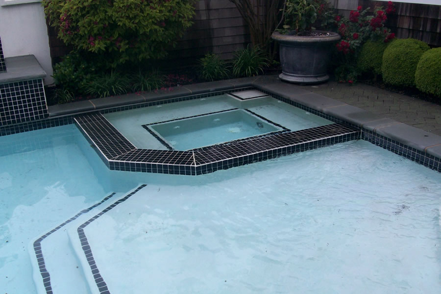 Outdoor Pool and Spa with Water Feature and Pool CoverResidential Pool Design by Omega Pool Structures, Inc